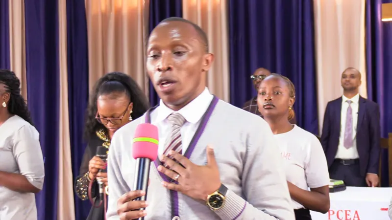 Simon Mugetha speaking at a church event