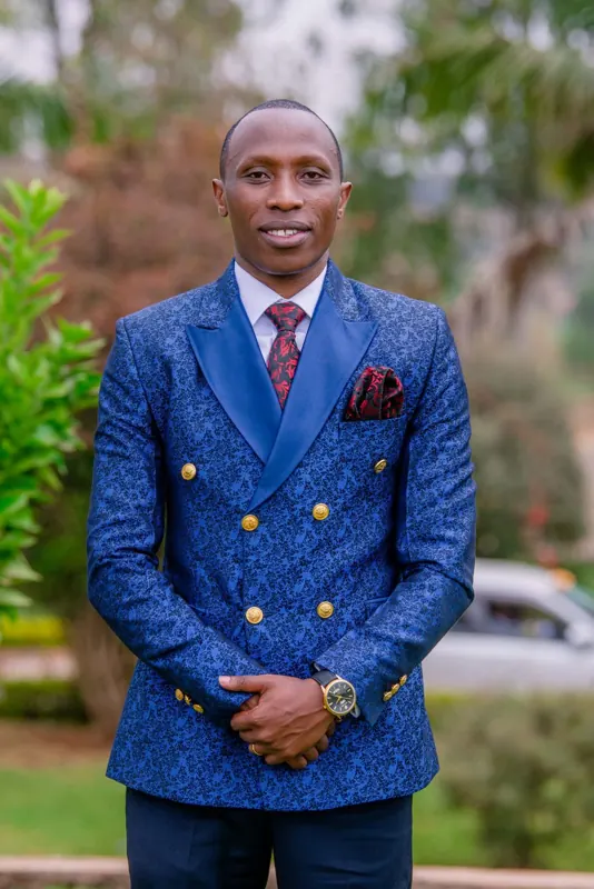 Simon Mugetha in a blue suit