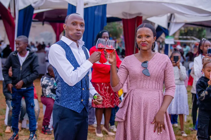 Simon Mugetha raising a toast at a wedding